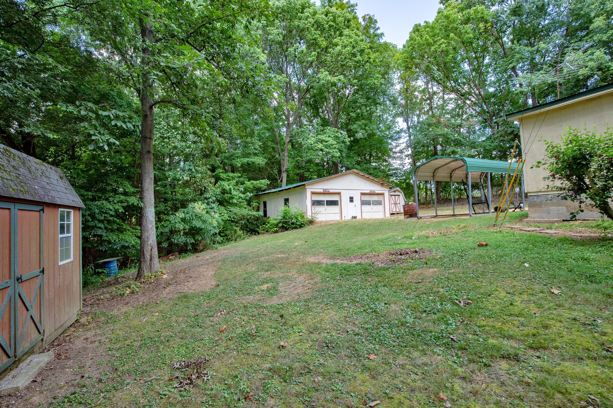 7498 Swift Road Greenbrier, TN 37073 - Photo 48 of 69 a view of house with outdoor space and garden