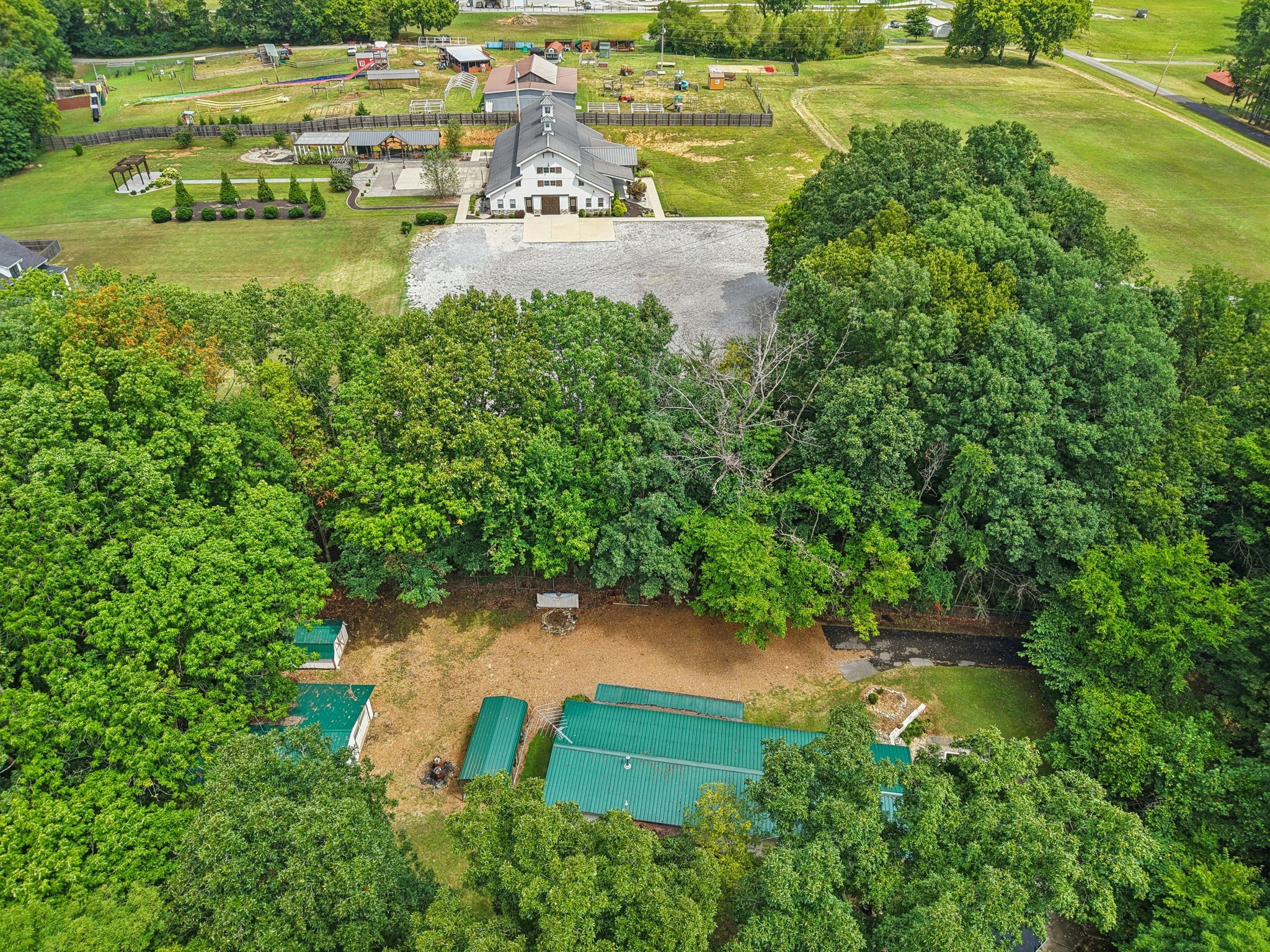7498 Swift Road Greenbrier, TN 37073 - Photo 7 of 69 an aerial view of a house with a yard and lake view
