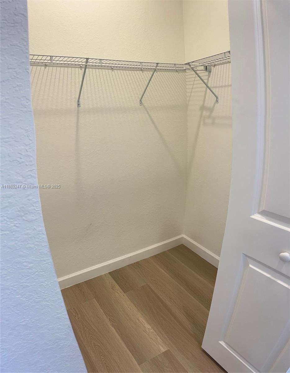 2651 Southeast 24th Drive Homestead, FL 33035 - Photo 16 of 40 a view of a room with racks on the wall