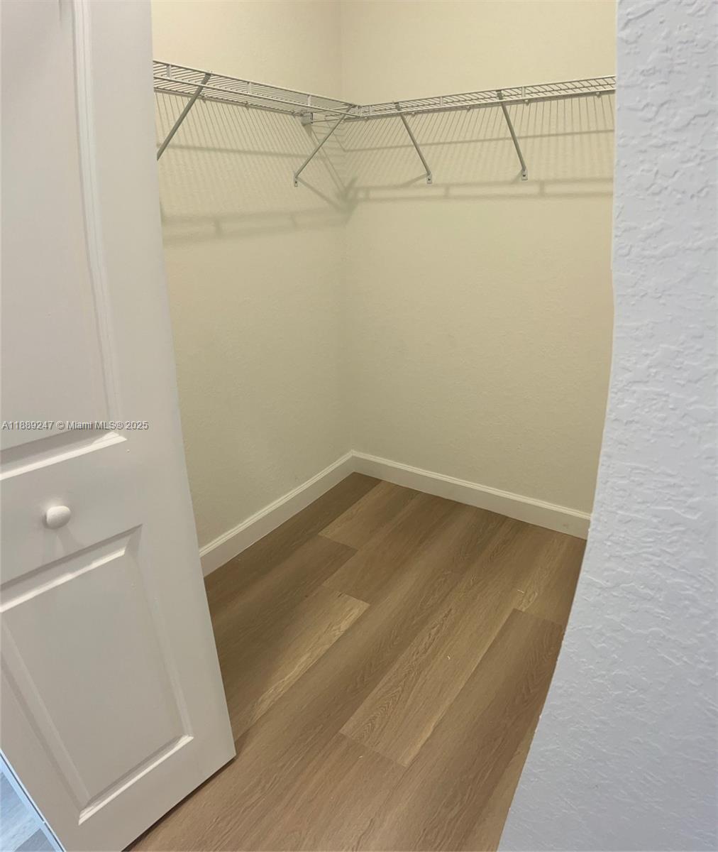 2651 Southeast 24th Drive Homestead, FL 33035 - Photo 17 of 40 a view of a room with racks on the wall