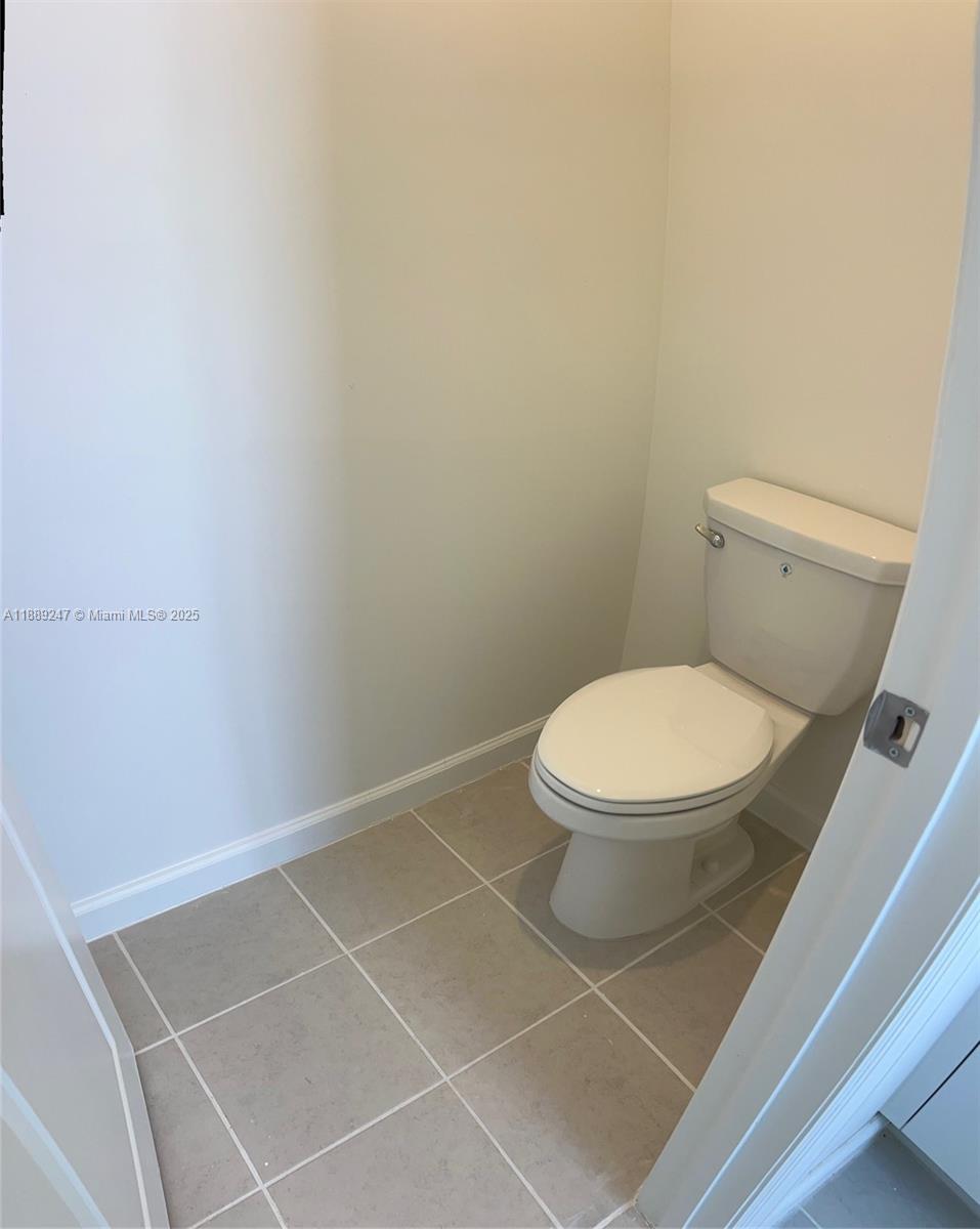 2651 Southeast 24th Drive Homestead, FL 33035 - Photo 21 of 40 a white toilet sitting next to a white sink