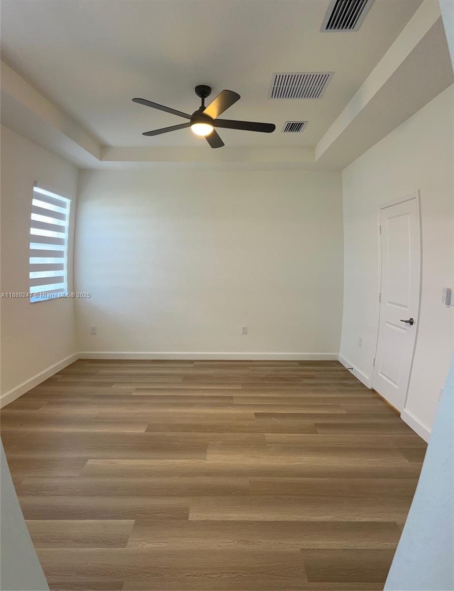 2651 Southeast 24th Drive Homestead, FL 33035 - Photo 23 of 40 a view of empty room with window and ceiling fan