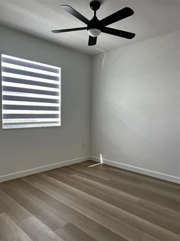 a view of a window in an empty room