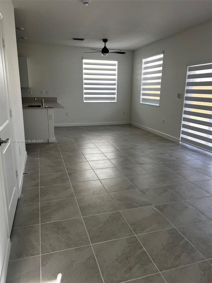2651 Southeast 24th Drive Homestead, FL 33035 - Photo 4 of 40 a view of an empty room with a window