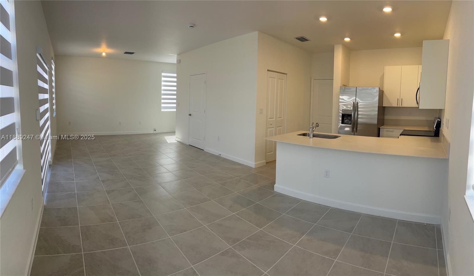 2651 Southeast 24th Drive Homestead, FL 33035 - Photo 6 of 40 a view of a kitchen with a sink and cabinets