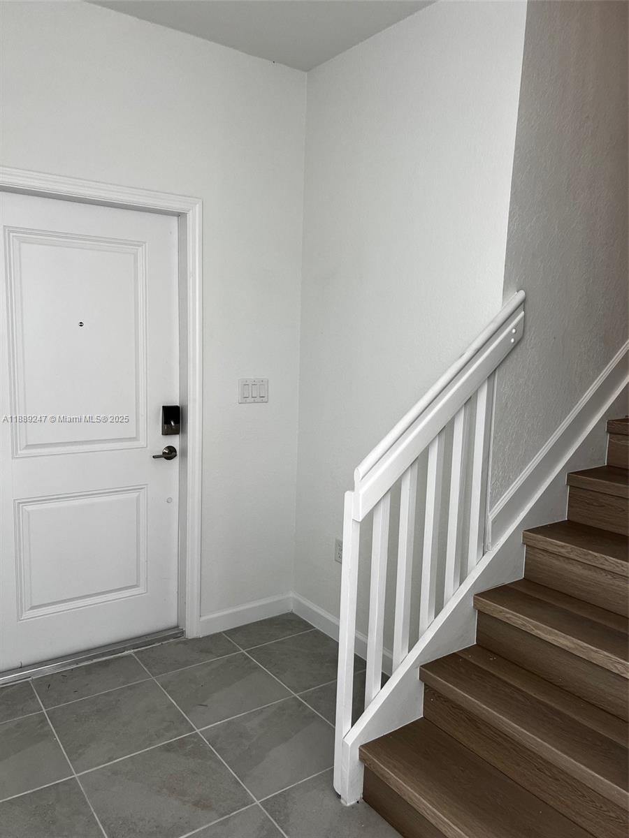 2651 Southeast 24th Drive Homestead, FL 33035 - Photo 10 of 40 a view of a hallway with staircase