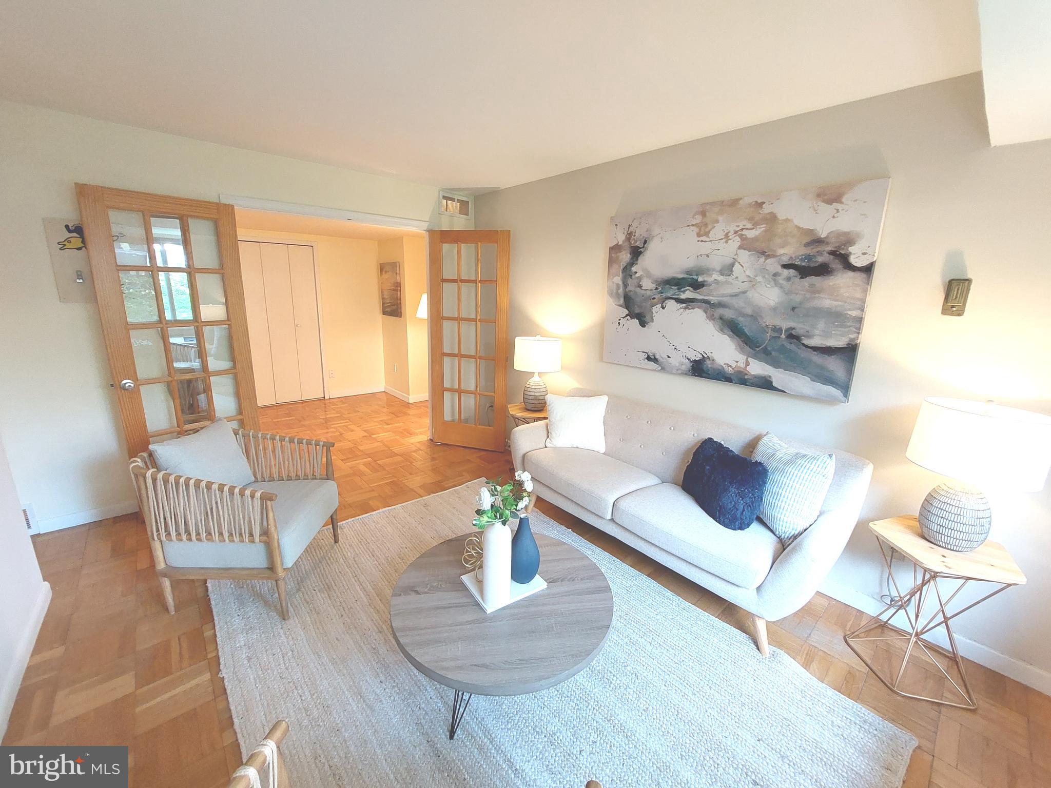 3900 Tunlaw Road Northwest, Unit 215 Washington, DC 20007 - Photo 6 of 44 Living Room with French Doors