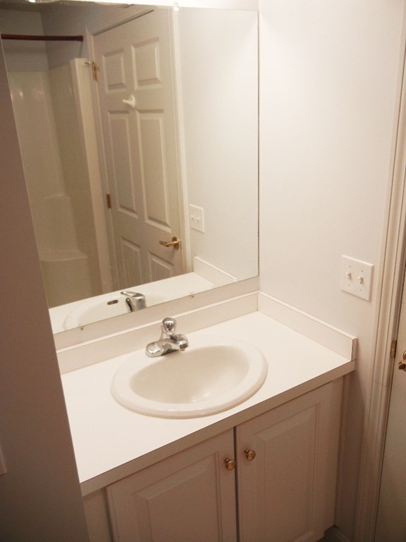 399 Bridge Road, Unit E Northampton, MA 01062 - Photo 11 of 17 a bathroom with a sink and a mirror