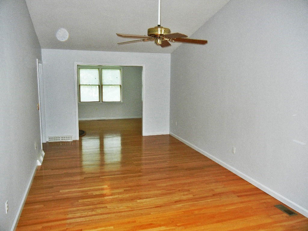 399 Bridge Road, Unit E Northampton, MA 01062 - Photo 5 of 17 a view of empty room with wooden floor
