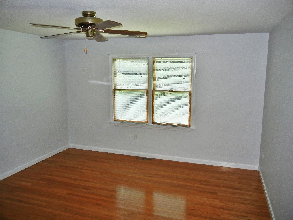 399 Bridge Road, Unit E Northampton, MA 01062 - Photo 7 of 17 wooden floor in an empty room with a window