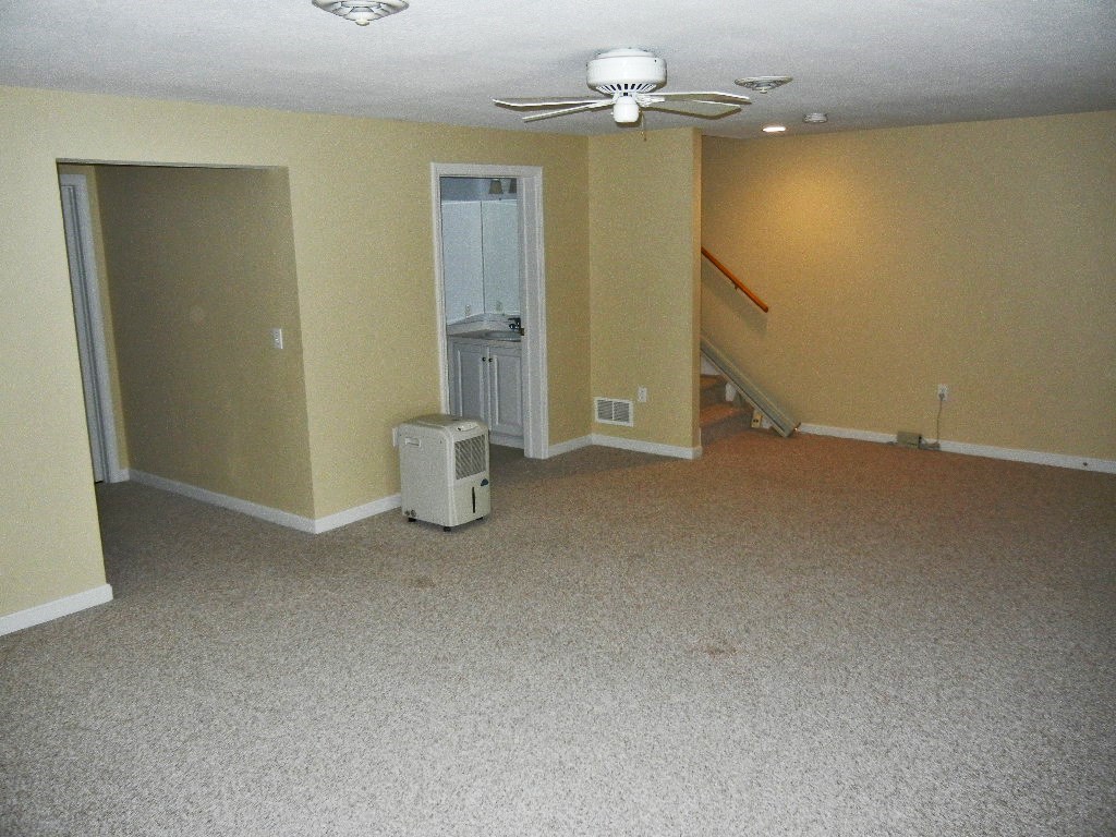399 Bridge Road, Unit E Northampton, MA 01062 - Photo 9 of 17 an empty room with a mirror