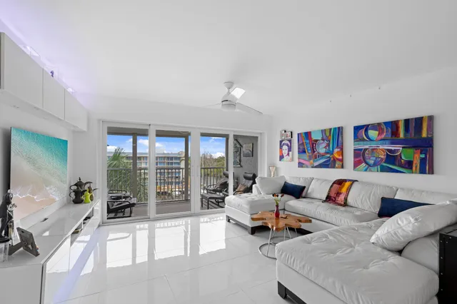 a view of roof deck with wooden floor and fence