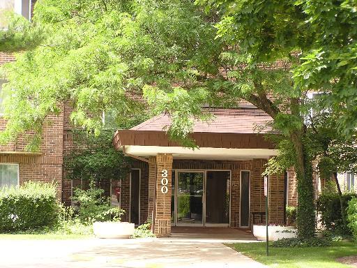 a view of a house with a tree