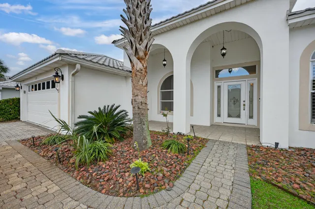 a view of empty room with wooden floor and fireplace