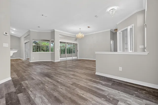 a view of an empty room with a fireplace