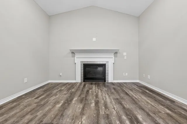 a spacious bathroom with a granite countertop sink and a mirror