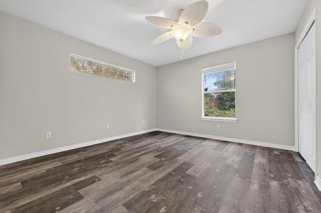 an aerial view of residential houses with outdoor space and street view