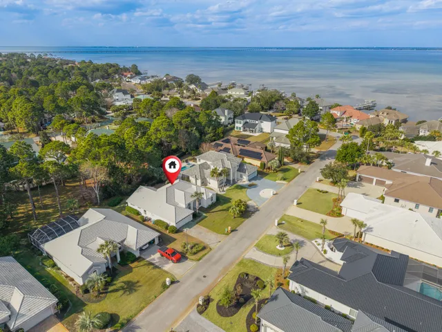 an aerial view of residential houses with outdoor space