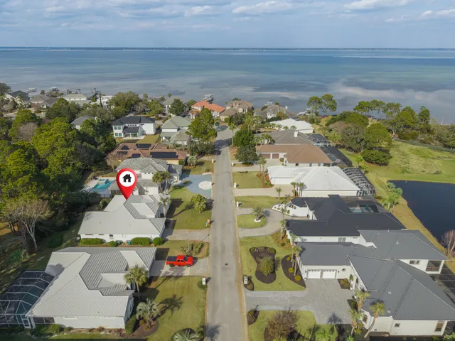 an aerial view of residential building and lake