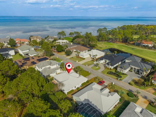an aerial view of a house with swimming pool