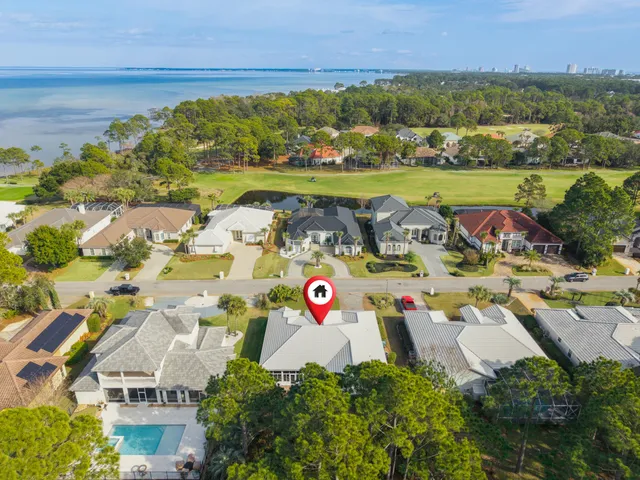 an aerial view of houses with outdoor space
