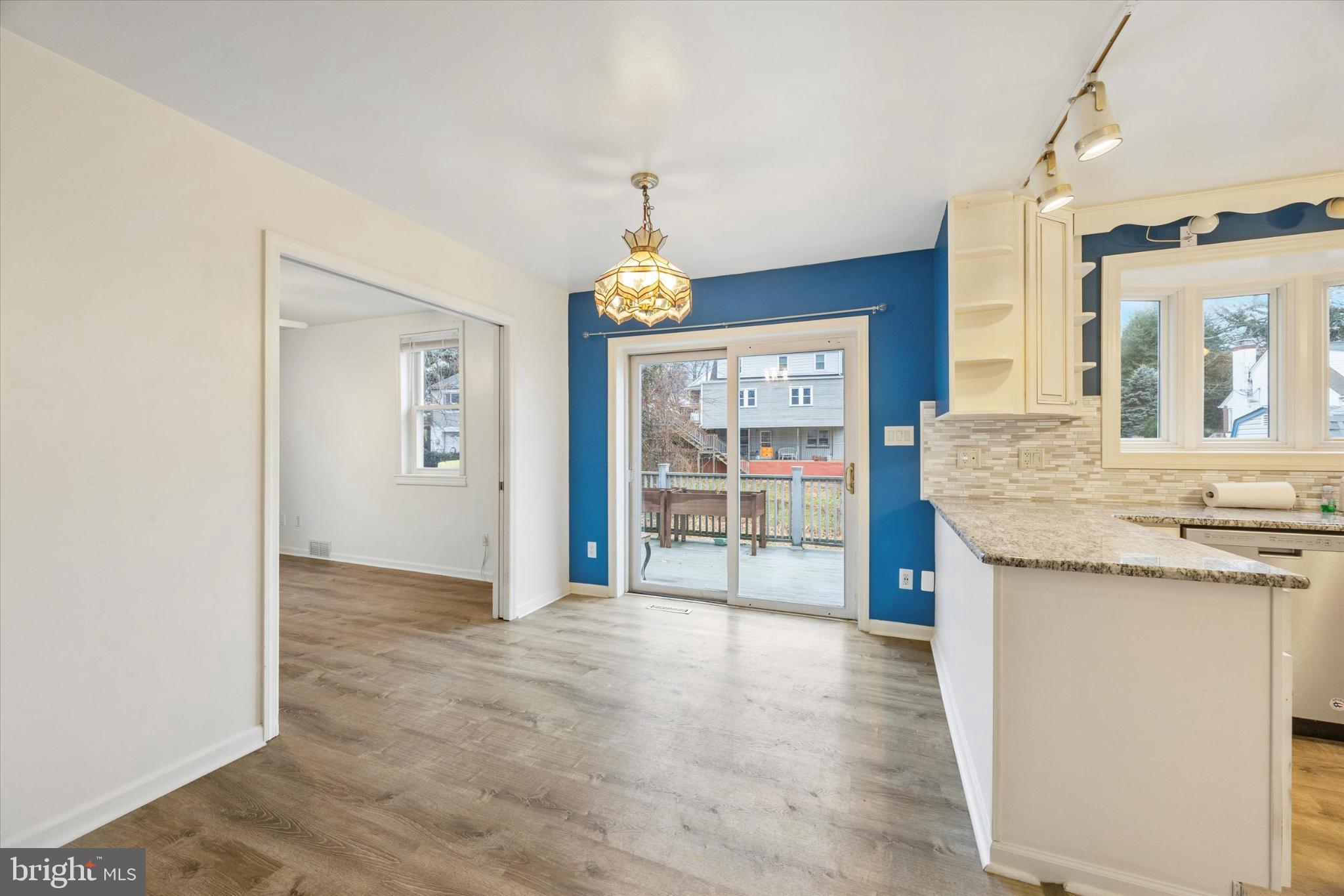 103 Valley Road Wilmington, DE 19804 - Photo 2 of 15 a view of an empty room with window and wooden floor