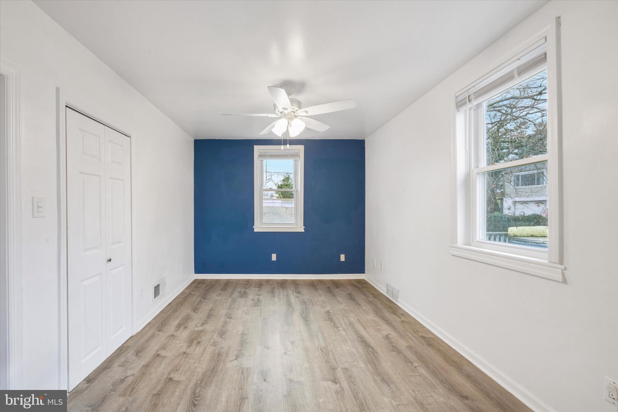 103 Valley Road Wilmington, DE 19804 - Photo 4 of 15 wooden floor in an empty room with a window