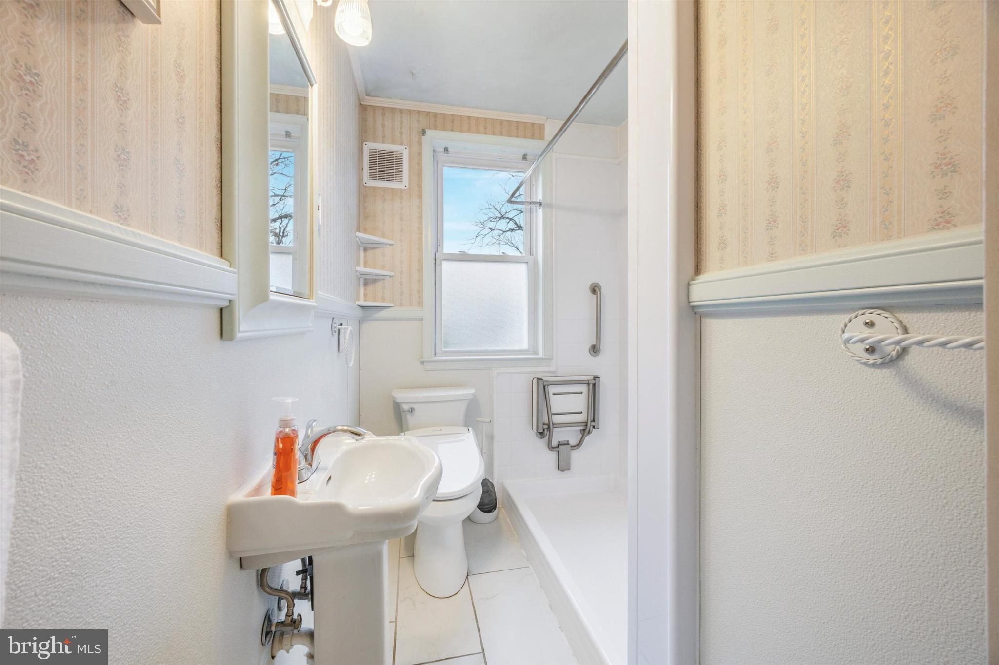 103 Valley Road Wilmington, DE 19804 - Photo 5 of 15 a bathroom with a sink and a mirror