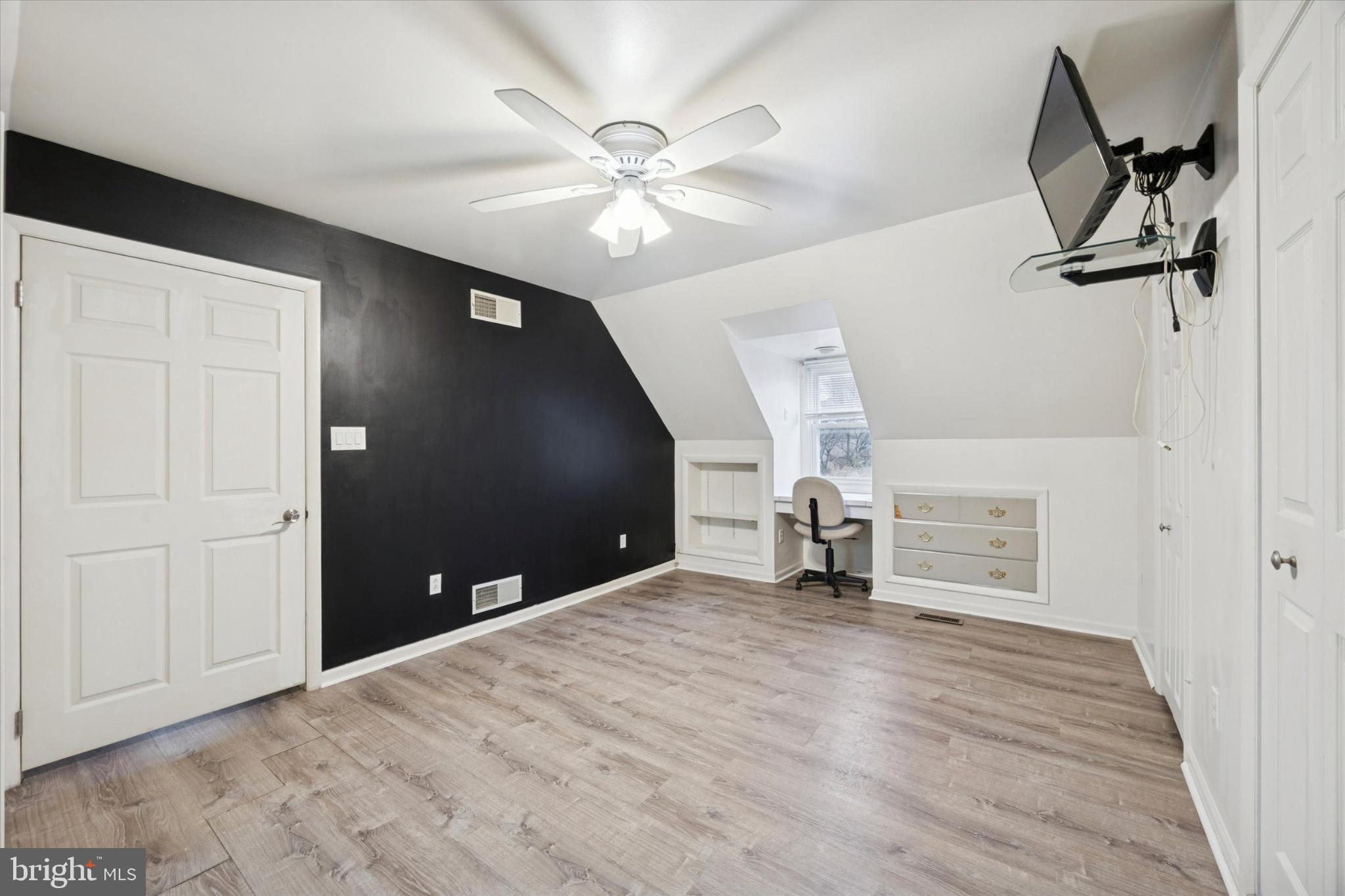 103 Valley Road Wilmington, DE 19804 - Photo 8 of 15 a view of a livingroom with a ceiling fan and wooden floor