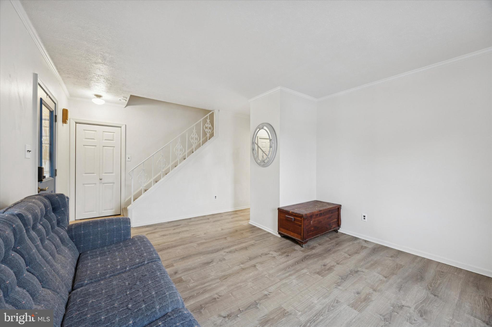 103 Valley Road Wilmington, DE 19804 - Photo 9 of 15 a view of room with a couch and a chandelier