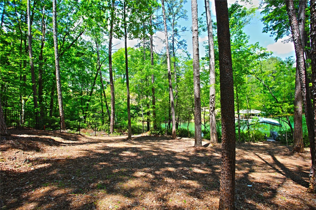 Lot 114 Harbor Point Seneca, SC 29672 - Photo 32 of 46 This serene wooded lot offers direct access to a tranquil lake, perfect for building your dream home.