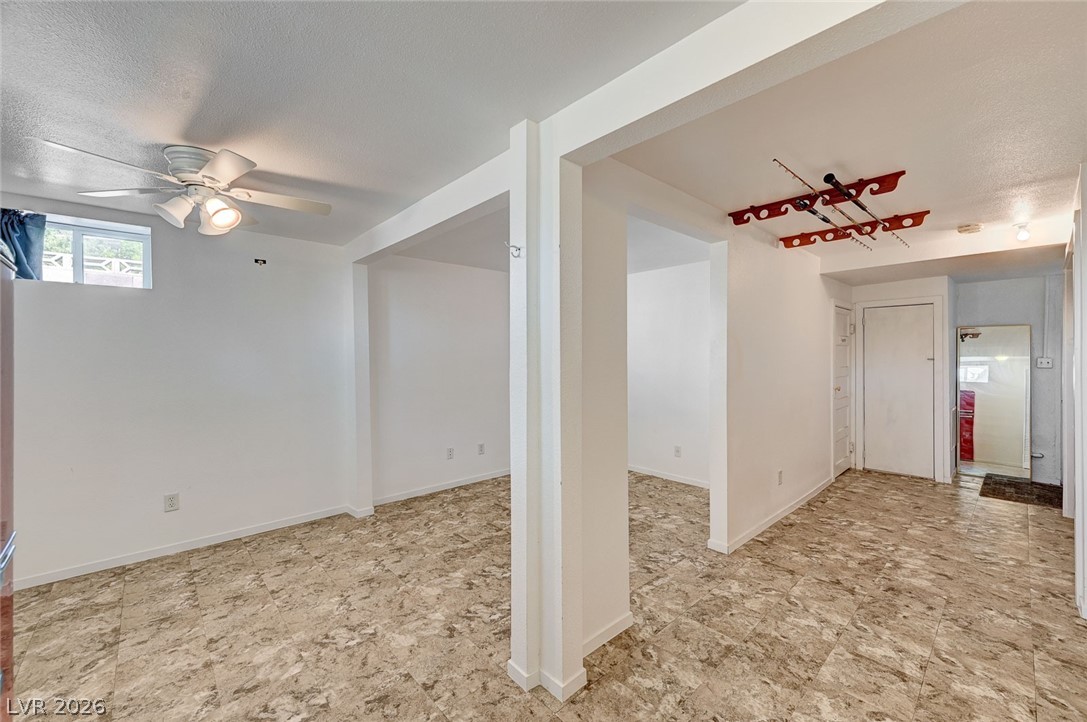 629 L Avenue Boulder City, NV 89005 - Photo 37 of 46 Office/bedroom/workout area featuring ceiling fan and a textured ceiling
