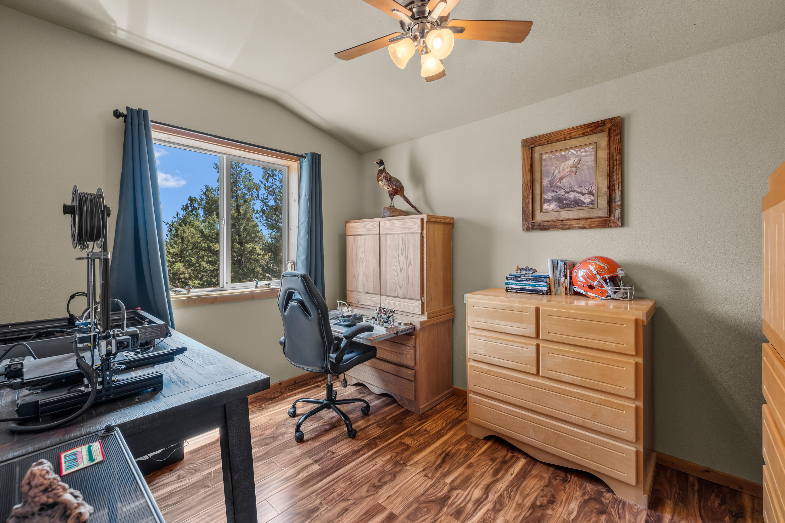 64145 Hunnell Road Bend, OR 97703 - Photo 59 of 65 One of three separate rooms within the upper-level guest/flex quarters, this bright space is currently used as a fly-tying craft room and offers excellent flexibility for hobbies, office use or creative pursuits.