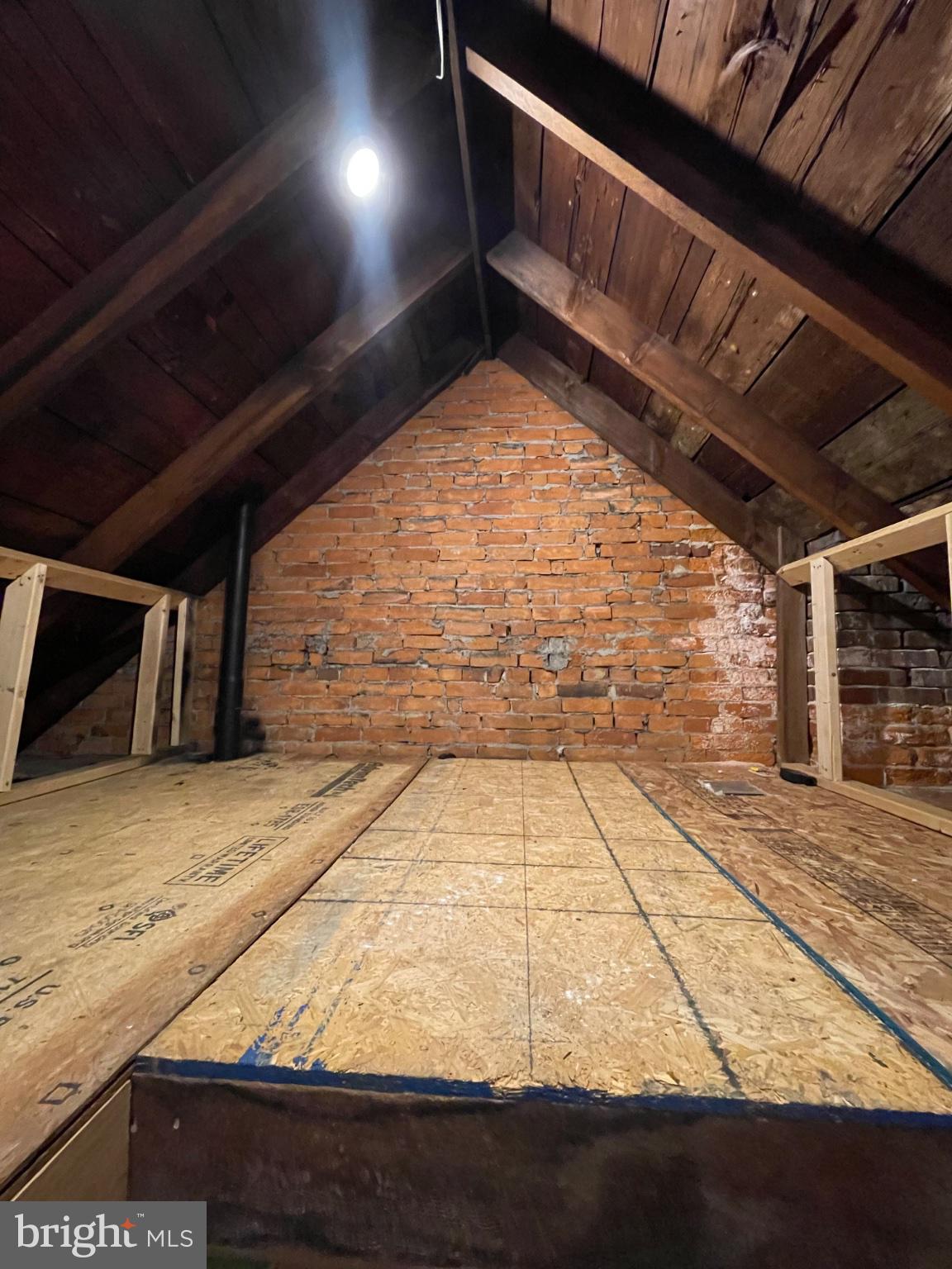 8129 Pine Road Philadelphia, PA 19111 - Photo 27 of 40 Rustic attic with exposed brick charm.