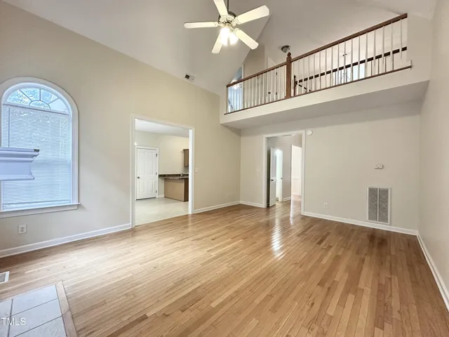a view of an entryway with wooden floor