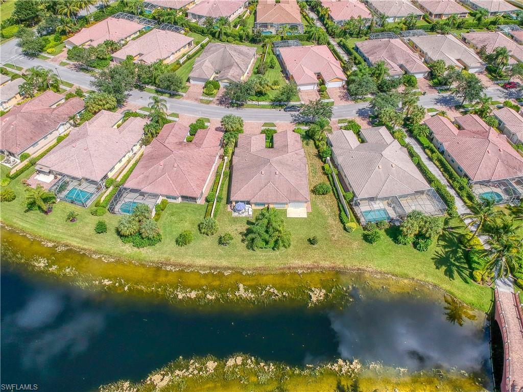 7390 Emilia Lane Naples, FL 34114 - Photo 18 of 25 an aerial view of residential houses with outdoor space