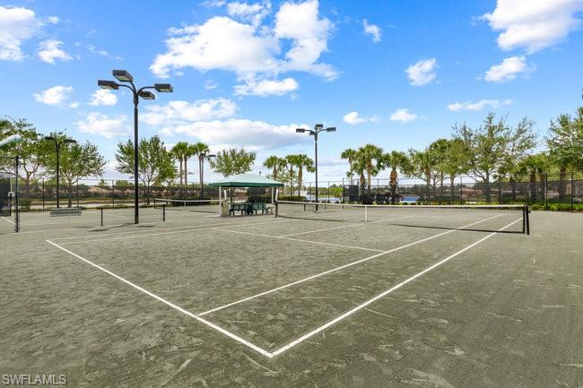 7390 Emilia Lane Naples, FL 34114 - Photo 19 of 25 a view of a tennis court