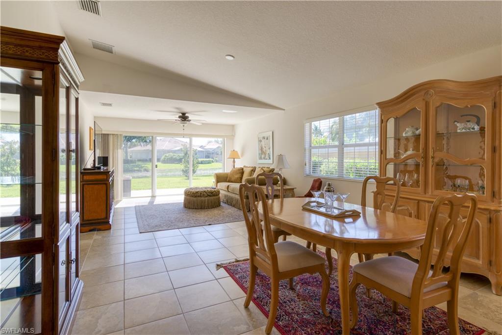 7390 Emilia Lane Naples, FL 34114 - Photo 7 of 25 a dining room with furniture and window