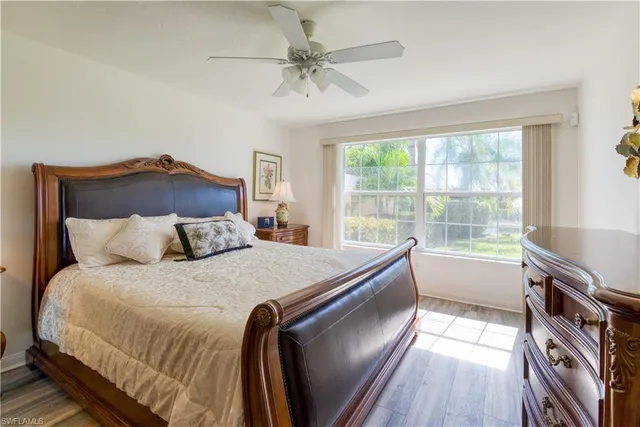 a bed sitting in a bedroom next to a window
