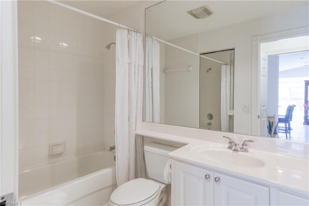 7390 Emilia Lane Naples, FL 34114 - Photo 10 of 25 a bathroom with a sink toilet and shower