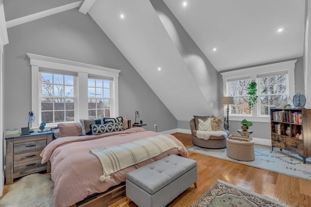 106 Bridge Street, Unit 8 Salem, MA 01970 - Photo 17 of 30 a bedroom with a large bed and a potted plant