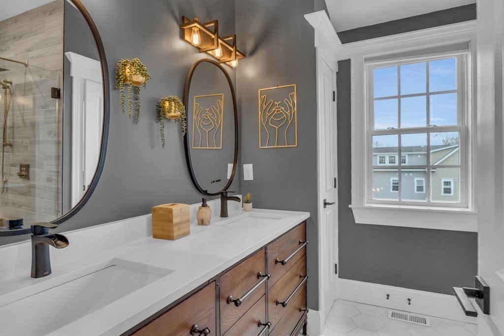 106 Bridge Street, Unit 8 Salem, MA 01970 - Photo 20 of 30 a bathroom with a sink vanity and a mirror