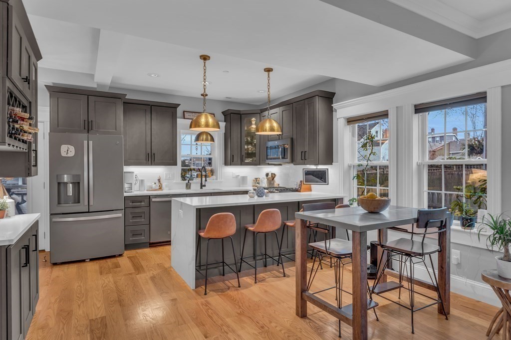106 Bridge Street, Unit 8 Salem, MA 01970 - Photo 2 of 30 a kitchen with granite countertop a sink and cabinets