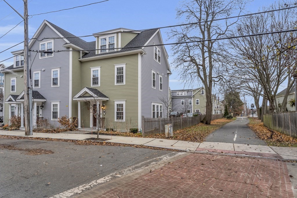 106 Bridge Street, Unit 8 Salem, MA 01970 - Photo 25 of 30 a front view of a house with a yard