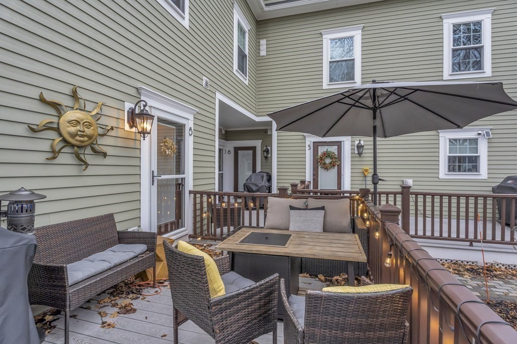 106 Bridge Street, Unit 8 Salem, MA 01970 - Photo 28 of 30 a balcony with table and chairs