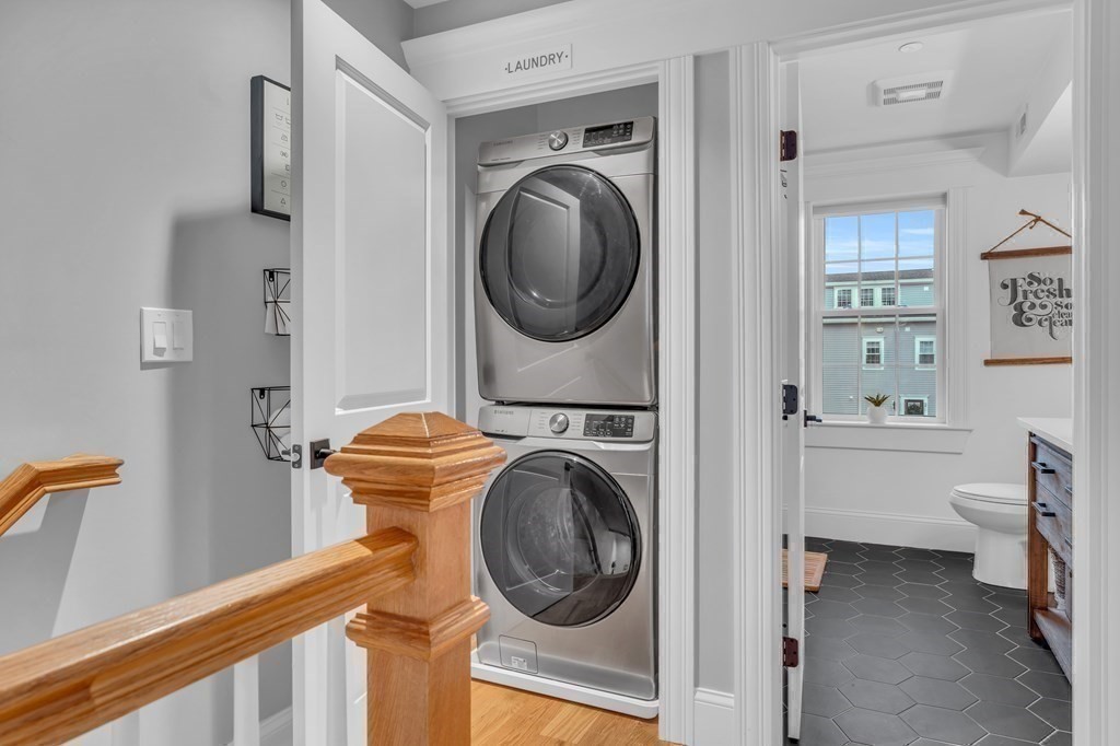 106 Bridge Street, Unit 8 Salem, MA 01970 - Photo 9 of 30 a view of a bedroom with washer and dryer