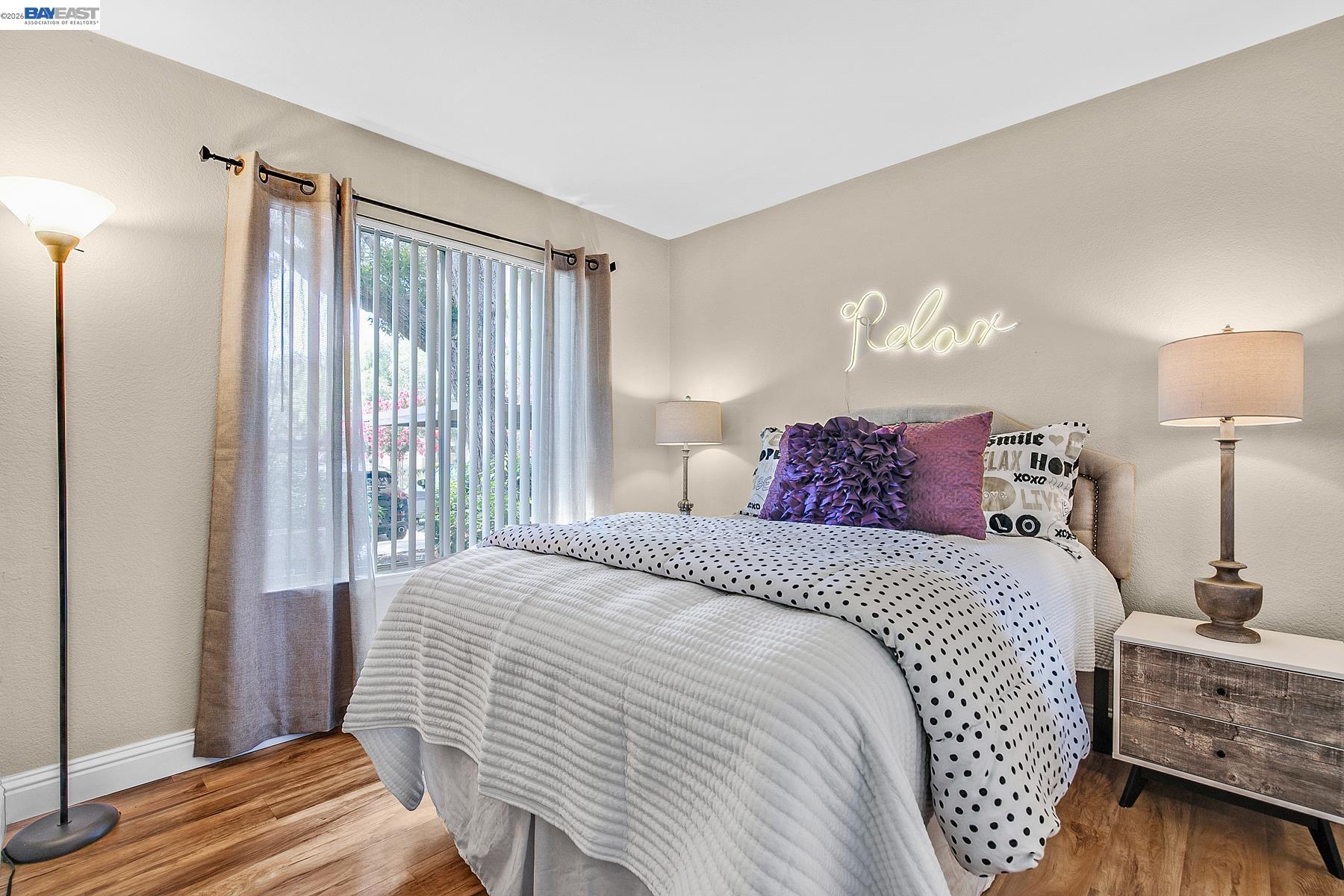 150 Reflections Drive, Unit 13 San Ramon, CA 94583 - Photo 14 of 33 a bedroom with a bed and wooden floor