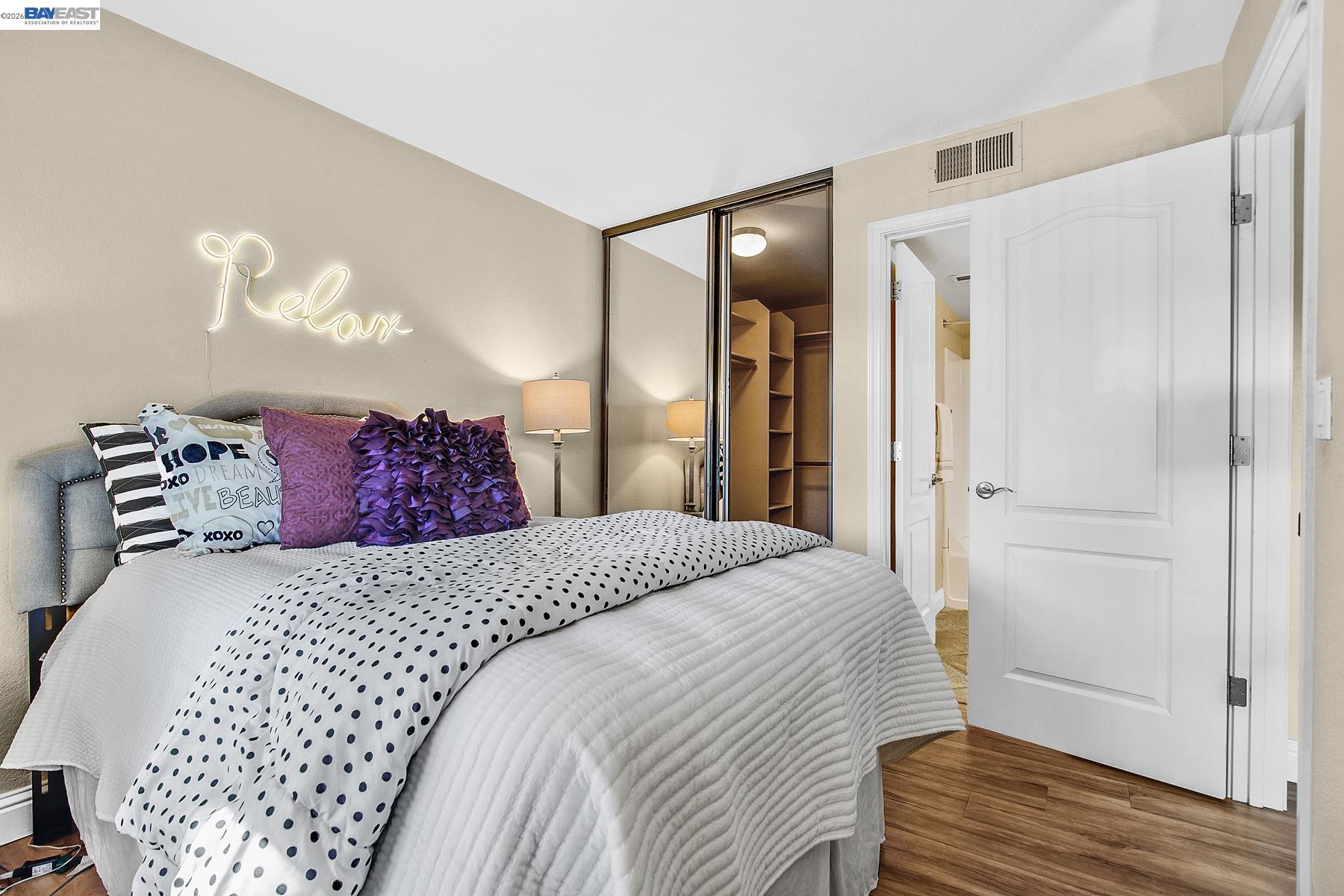 150 Reflections Drive, Unit 13 San Ramon, CA 94583 - Photo 18 of 33 a bedroom with a bed and a mirror