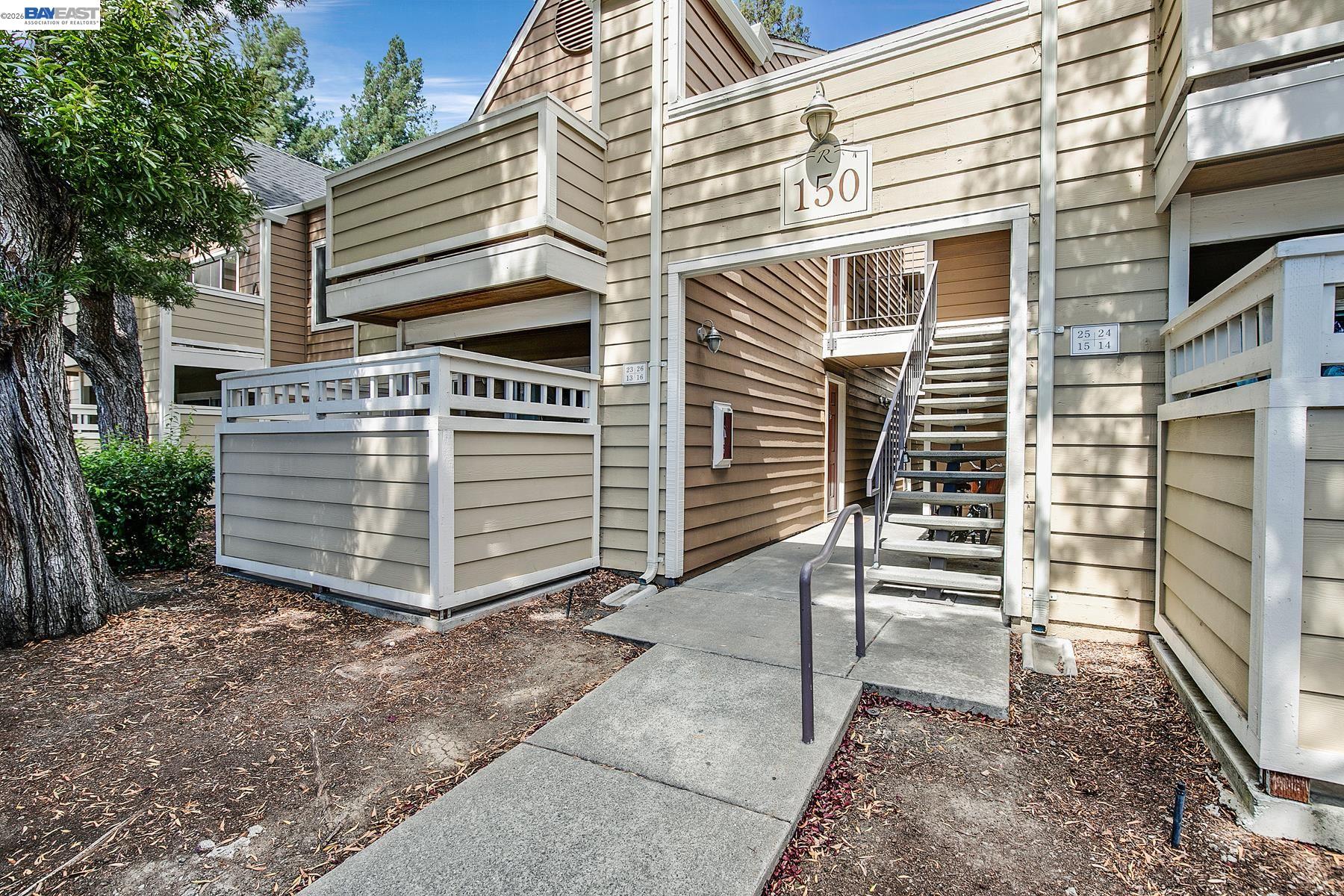 150 Reflections Drive, Unit 13 San Ramon, CA 94583 - Photo 2 of 33 a view of a house with a yard