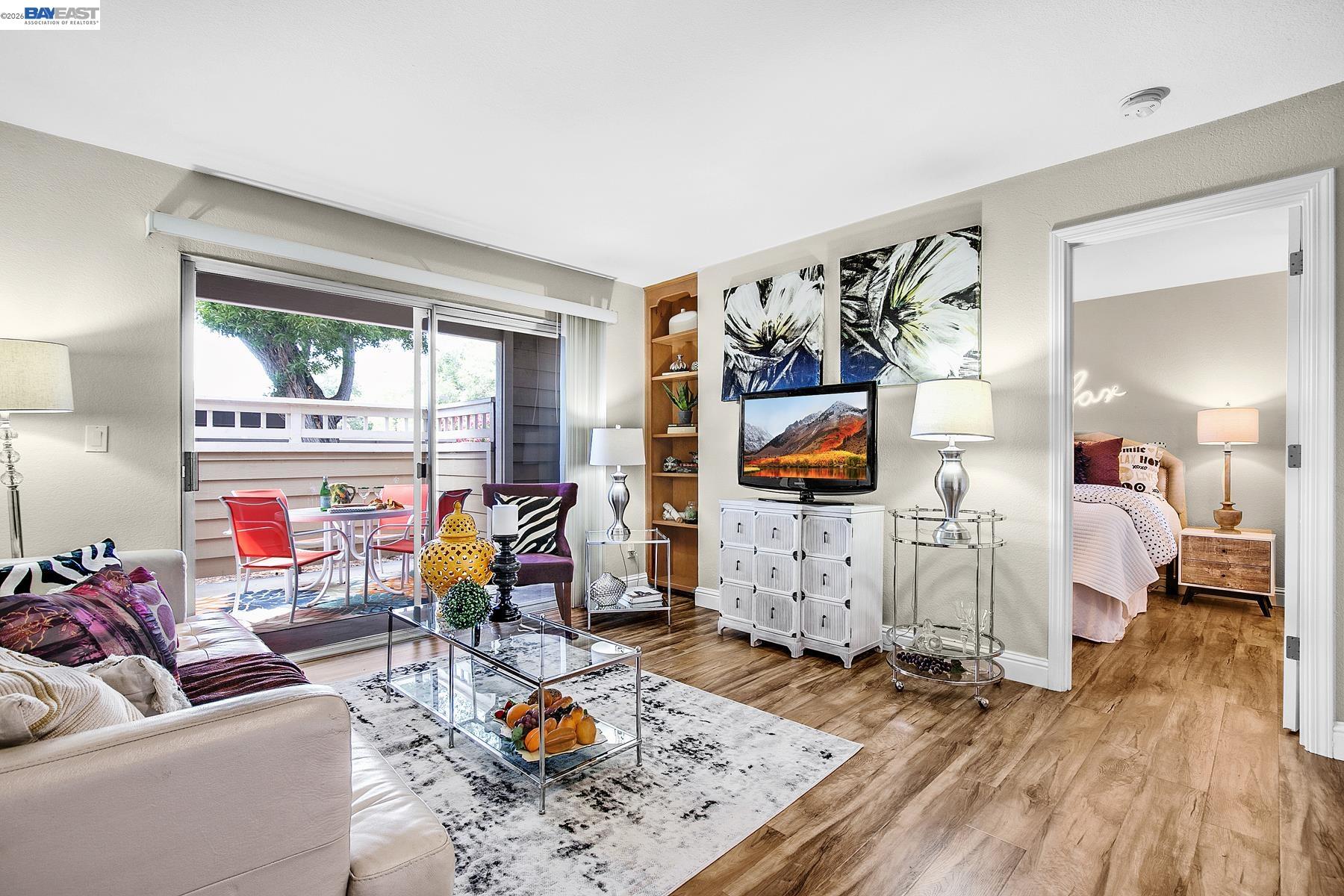150 Reflections Drive, Unit 13 San Ramon, CA 94583 - Photo 5 of 33 a living room with furniture and a flat screen tv